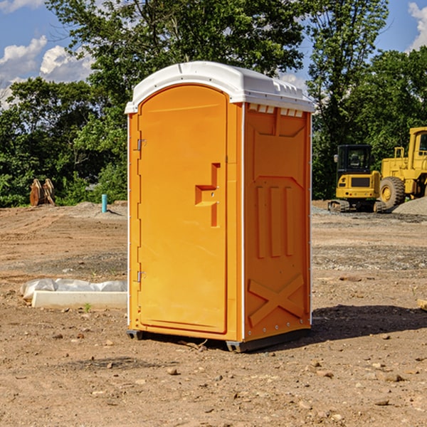 what is the cost difference between standard and deluxe portable restroom rentals in Dolliver